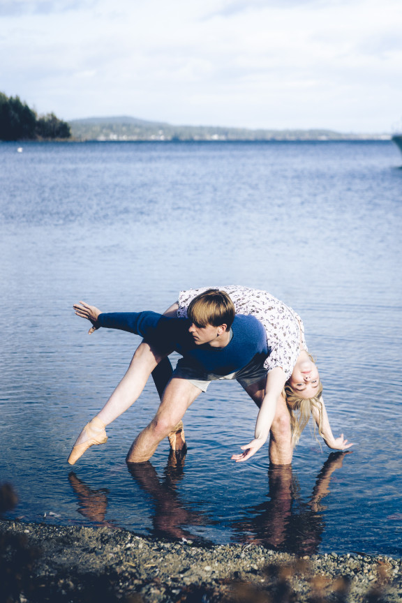 Two students posing for a dance photo in the water